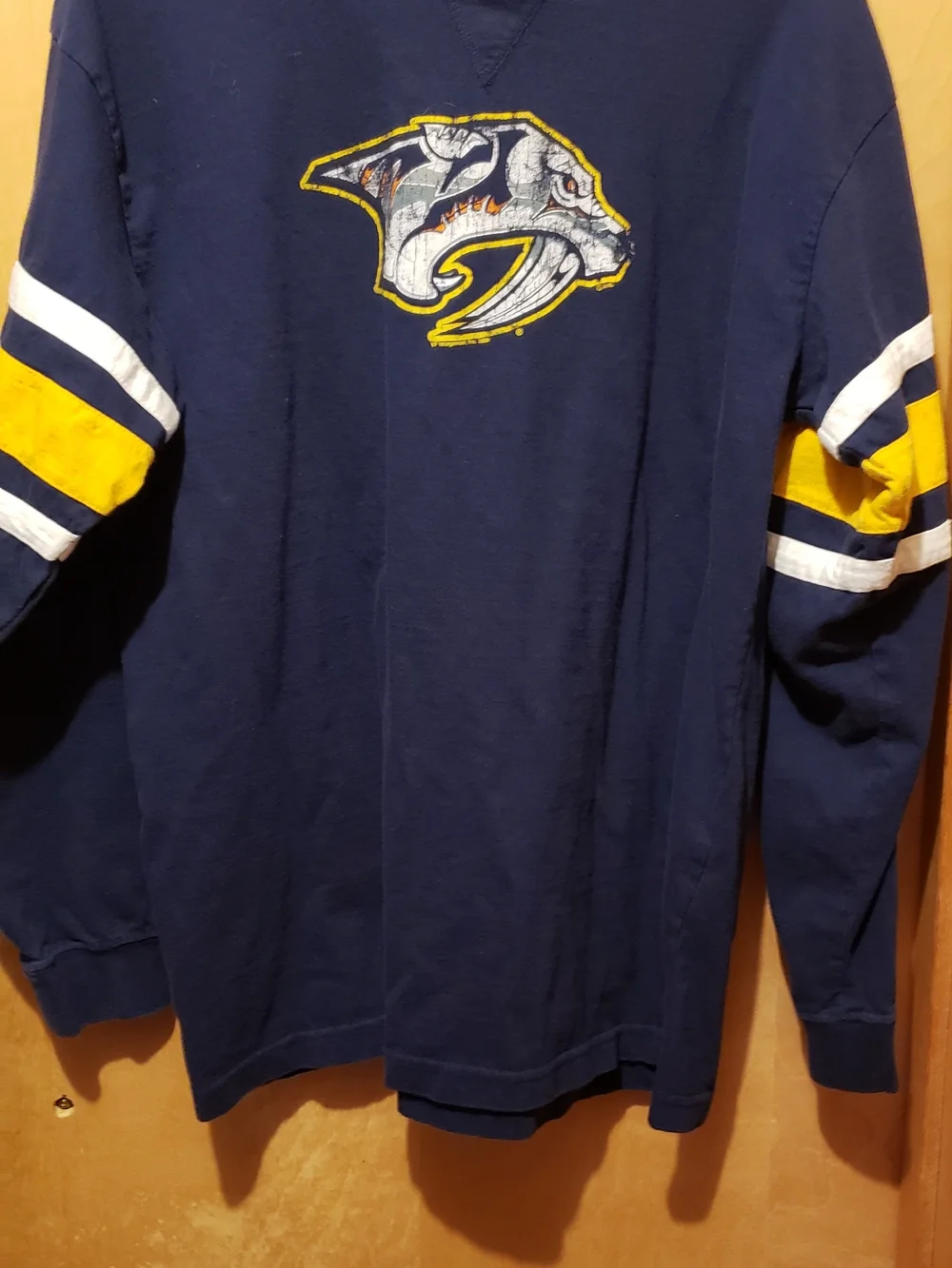 Majestic Navy Blue  Nashville Pred shirt with Yellow Trim and Red-Blue Logo